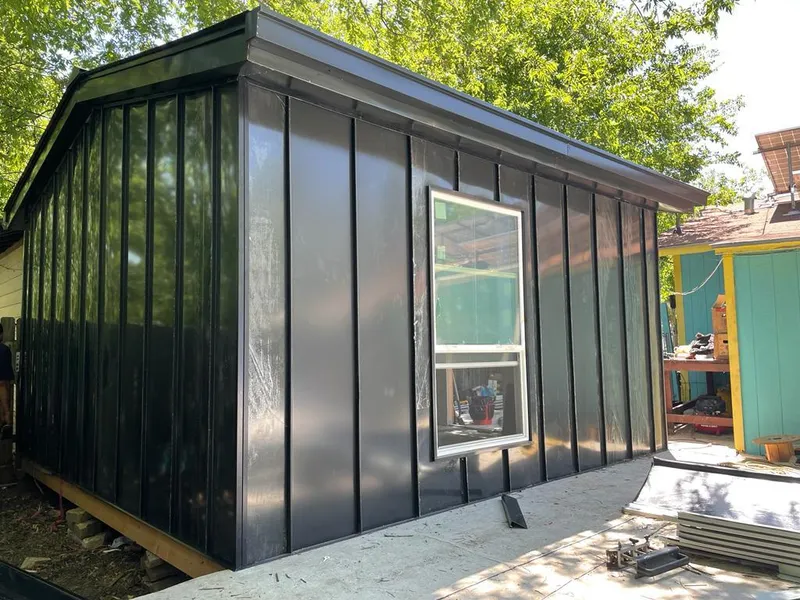 Black standing seam metal wall panels for Metal Roof Installation in Artesia